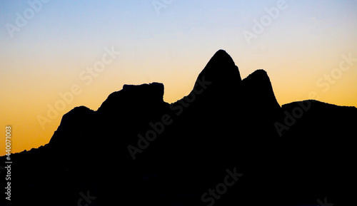 Silhouette of gavea stone and two hill brother in rio de janeiro Brazil.