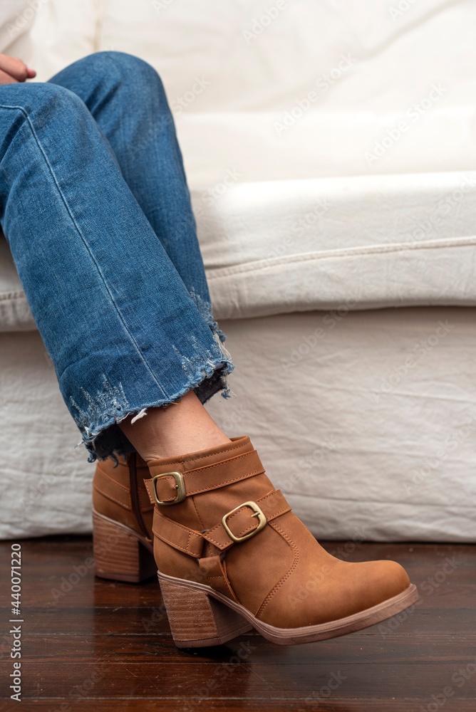 woman legs wearing brown black leather fashion shoes with casual clothes with very stylish bottom woman legs wearing brown black leather fashion shoes with casual clothes with very stylish bottom