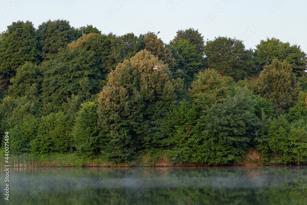 Beautiful landscape with a lake at sunrise in the morning Beautiful landscape with a lake at sunrise in the morning