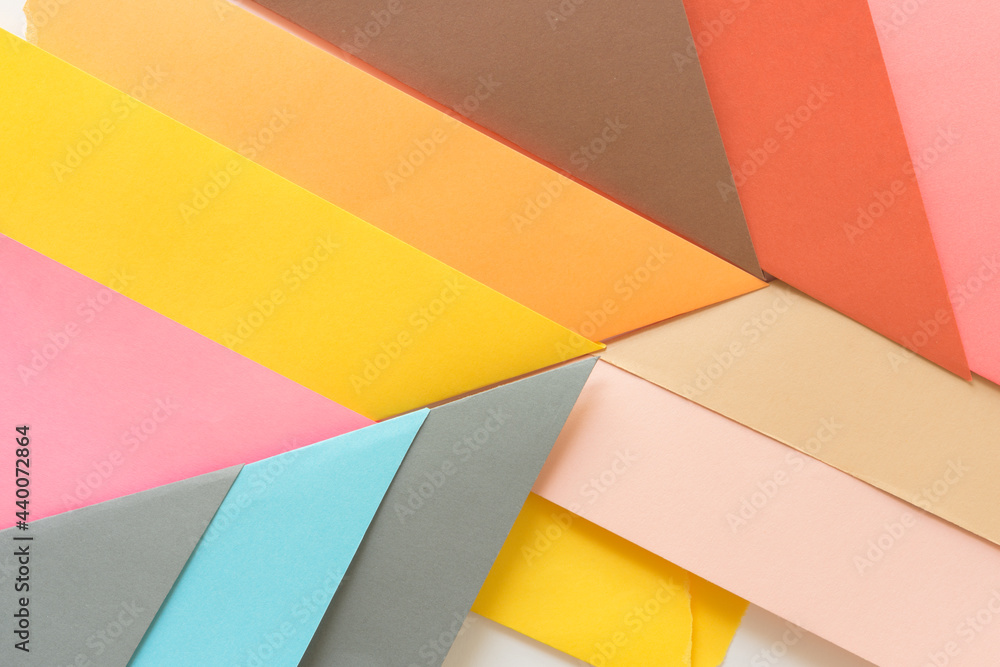 triangle-shaped folded construction paper background - orange brown red pink blue grey tan triangle-shaped folded construction paper background - orange brown red pink blue grey tan