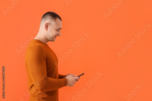 Young man with mobile phone...
