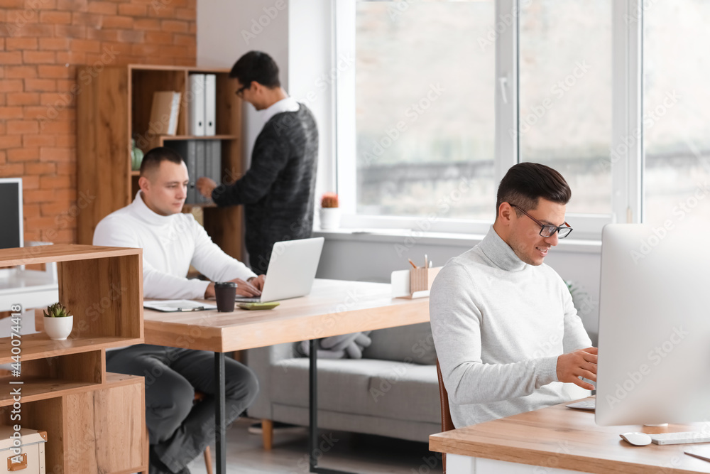 Male accountants working in office Male accountants working in office