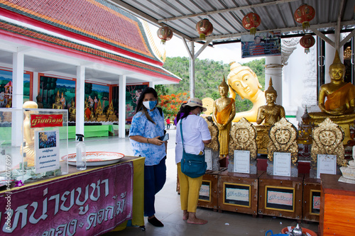 Buddha statue of Wat Khao Sung Chaem Fa temple on Khao Sam Sip Hap mountain for thai people and foreign travelers travel visit and respect praying at Tha Maka on May 23, 2021 in Kanchanaburi, Thailand