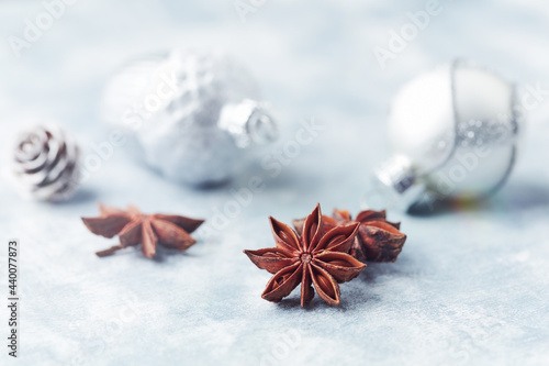 Tableau sur toile Star anise and Christmas balls on bright wooden background