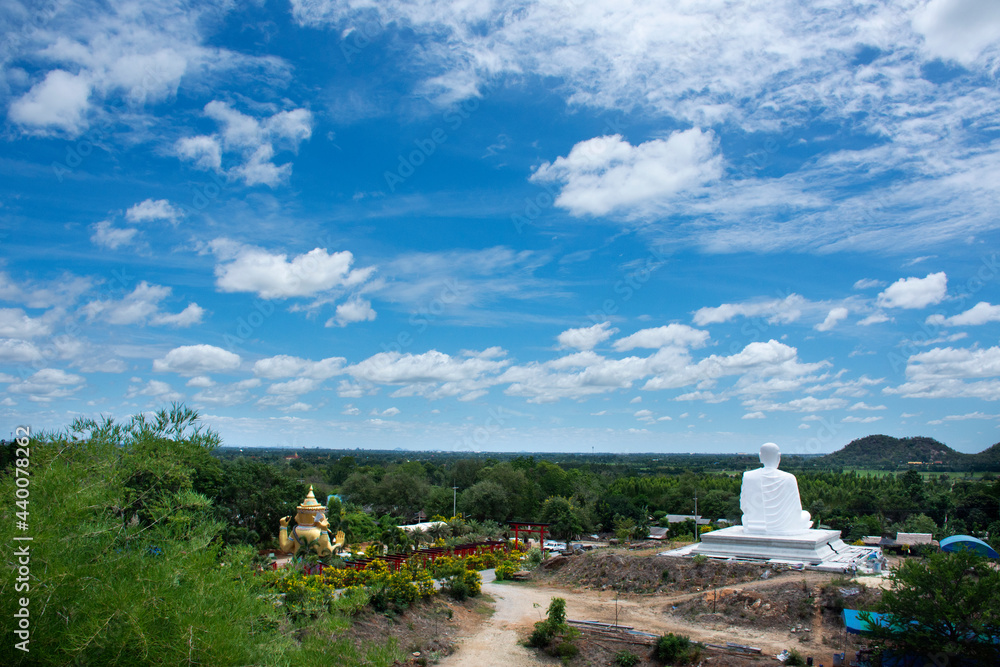 View landscape of Khao Sam Sip Hap mountain with red torii gate and Ganesha and monks statue for thai and foreign travelers visit in Wat Khao Sung Chaem Fa temple at Tha Maka in Kanchanaburi, Thailand