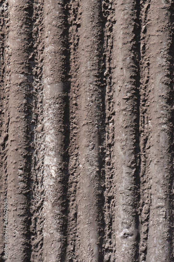 Corrugated metal with brown paint. Corrugated metal with brown paint.