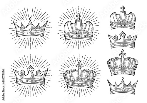 Four different king crowns. Engraving vintage vector black illustration.