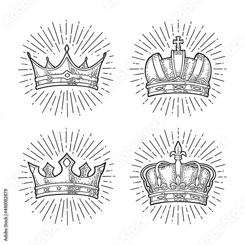 Four different king crowns with rays. Engraving vintage vector black illustration.