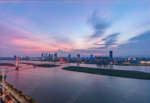 The aerial view of the city is located on both sides of the Ganjiang River. The Bayi Bridge crosses the river and forms a magnificent view against the surrounding buildings. Nanchang City, China.
