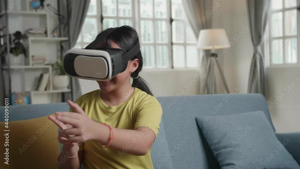 Asian Girl Playing Video Game While Wearing Vr Glasses Headset At Home
Asian Girl Playing Video Game While Wearing Vr Glasses Headset At Home