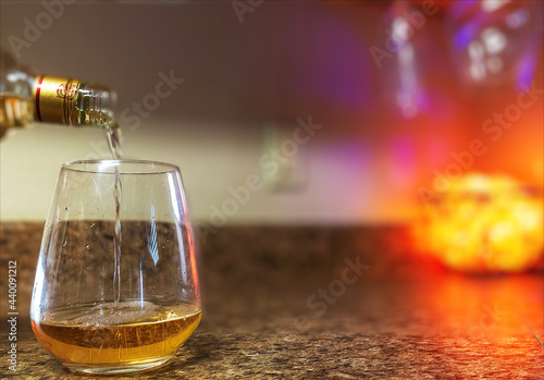 Fototapeta Naklejka Na Ścianę i Meble -  Pouring liquid in a glass