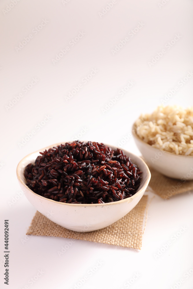 Organic boiled brown rice on bowl isolated in white background Organic boiled brown rice on bowl isolated in white background