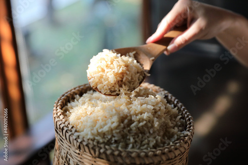 Organic boiled brown rice on Wicker basket in close up