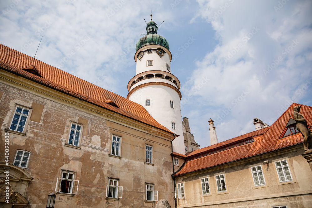 Baroque romantic castle Nove mesto nad Metuji with park, renaissance chateau, round white clock tower, red tile roof, Italian garden, summer sunny day, Eastern Bohemia, Czech Republic Baroque romantic castle Nove mesto nad Metuji with park, renaissance chateau, round white clock tower, red tile roof, Italian garden, summer sunny day, Eastern Bohemia, Czech Republic