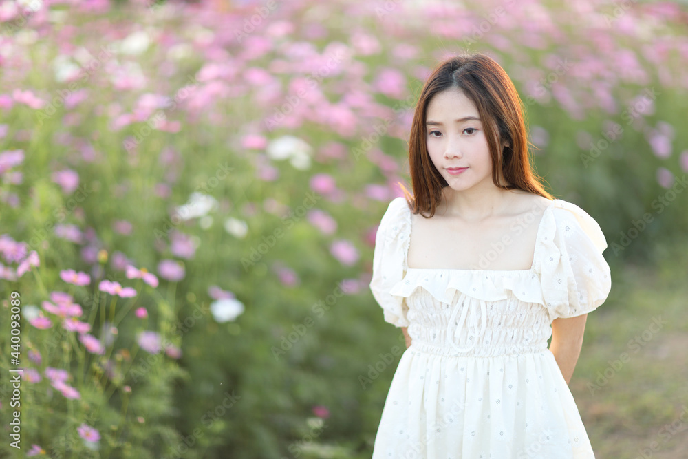 Beautiful young woman with white dress on garden background Beautiful young woman with white dress on garden background