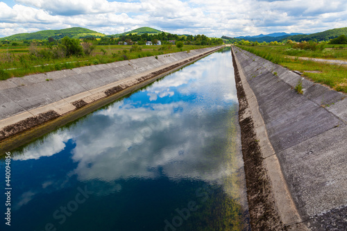 The regulated and artificial riverbed of the Gacka River in Lika region, Croatia