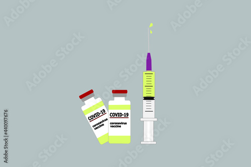 syringe drawing vaccine and COVID-19 vaccine vials on grey background. concept of campaign to be vaccinated for community immunization to save the world from Covid-19 outbreak pandemic.