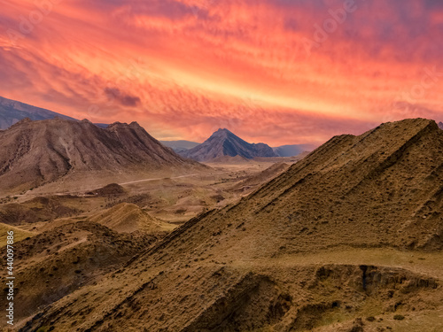 Mountain landscape against the backdrop of a fiery red sunset
