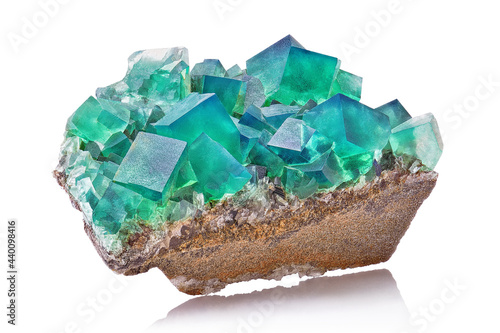 Amazing macro closeup of green blue rare fluorite mineral specimen isolated on white background. Rare double color mineral gem stone (fluorspar) from Rogerley in England. Natural cubic crystals