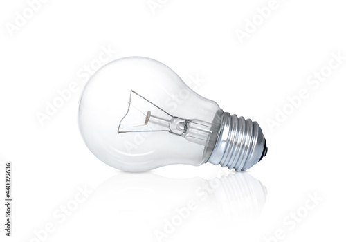 transparent light bulb lies isolated on white background
