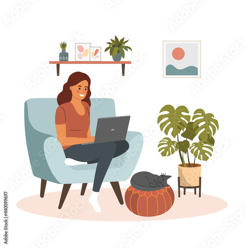 Young woman is relaxing on comfortable chair and using laptop. Сat is lying on the ottoman. Vector flat illustration
