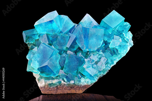 Amazing colorful macro closeup of aqua blue rare fluorite mineral specimen isolated on black background. Natural marine mineral gem stone (fluorspar). Natural cubic texture - Fluorite crystals detail