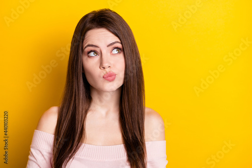 Photo of young thoughtful minded curious dreamy woman look copyspace thinking isolated on yellow color background © deagreez