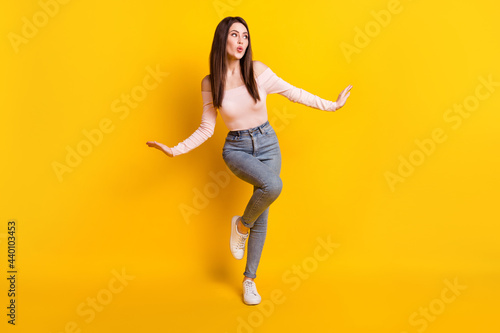 Fototapeta Naklejka Na Ścianę i Meble -  Full size photo of young beautiful lovely stunning girl look copyspace dreaming isolated on yellow color background