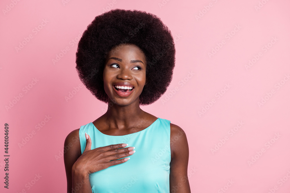 Photo of young beautiful stunning cheerful girl look copyspace hold hand chest laugh isolated on pink color background