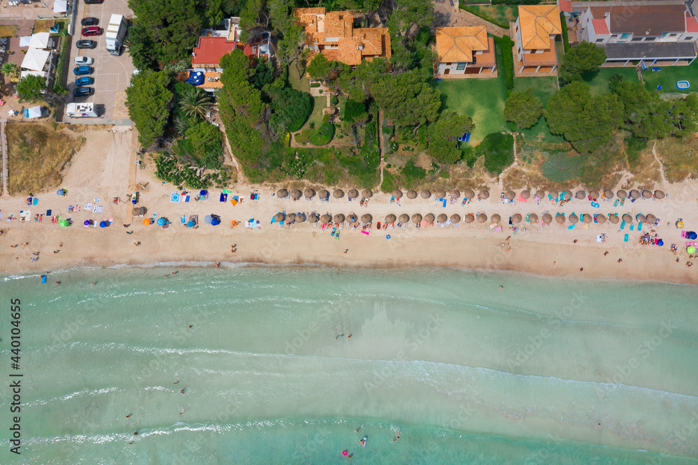 An aerial top down view on Playa de Muro beach on Mallorca island in Spain