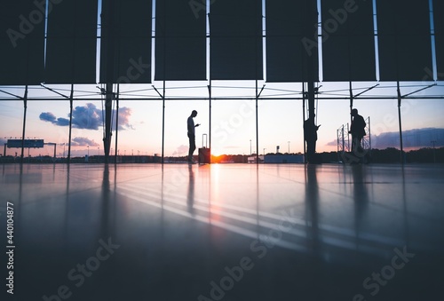 silhouette of people at airport