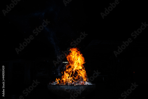 Campfire n a field at night photo