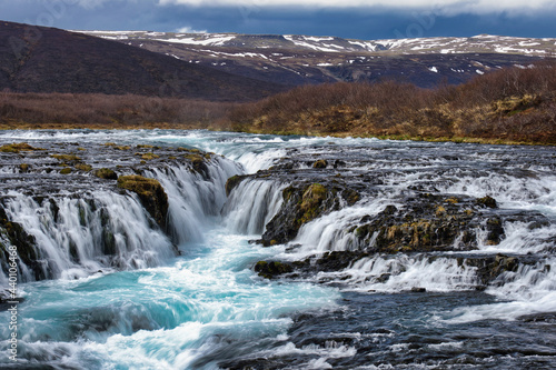 Bruarfoss waterfall in Iceland showing it's true blue colors on a cold spring day