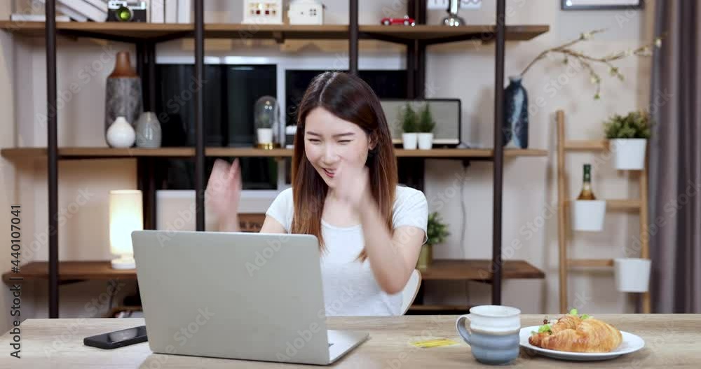 Beautiful woman works at home with a laptop computer, Asian businesswoman meeting online via video at home. Beautiful woman works at home with a laptop computer, Asian businesswoman meeting online via video at home.