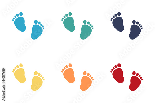 Set of vector illustrations of baby steps - a pair of multicolored footprints in a flat style.