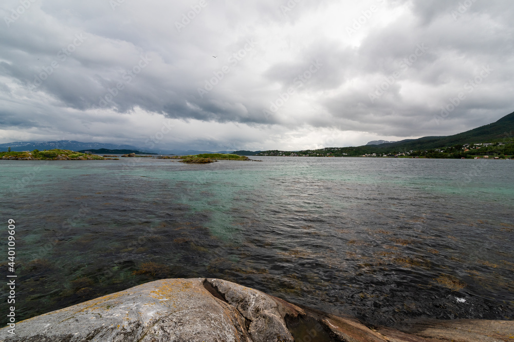 bay in the fjord, clear water, rocky coast