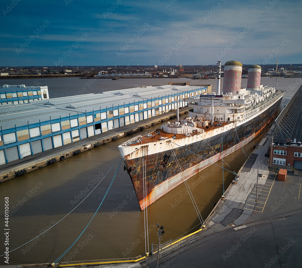 peeling paint and rust on the old and retired ocean liner which set and still holds the transatlantic crossing of the Atlantic ocean record set in 1959 shipyard awaiting restoration