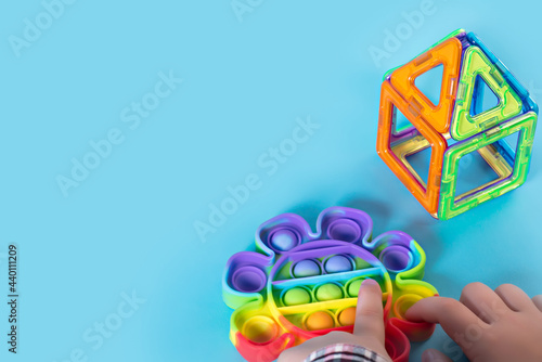 Rainbow Pop it fidget toy on a empty copy space background