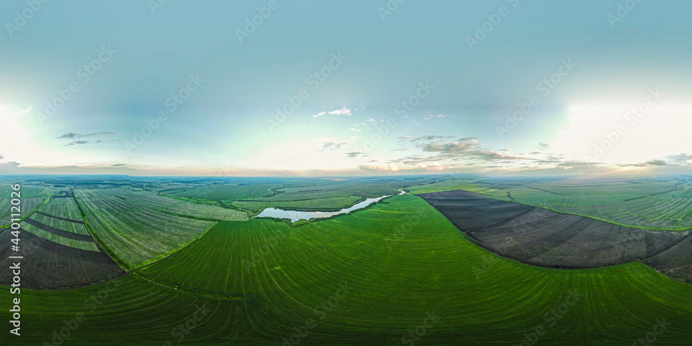 Fototapeta premium the lake in the middle of endless green fields