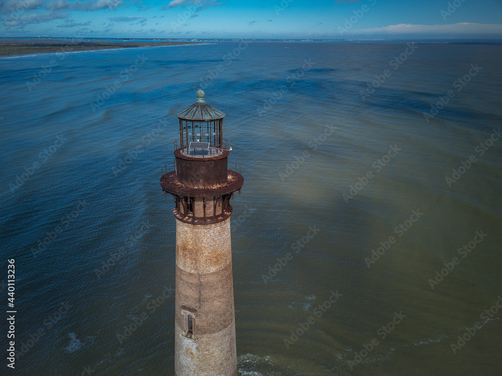 Aerial drone image of the Morris Island Lighthouse at the entrance to Charleston Harbor South Carolina