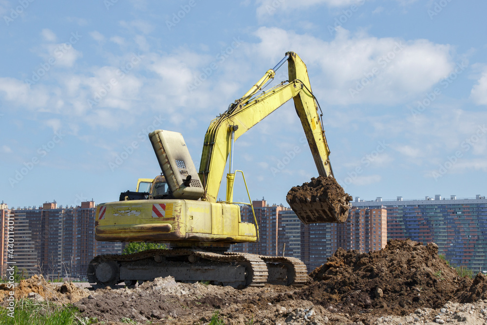 Construction equipment in the background of the city Construction equipment in the background of the city