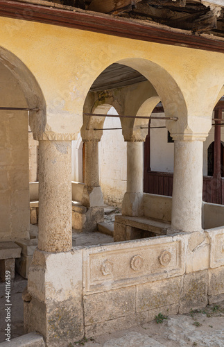 An ancient building with arches and ornaments made of stone .