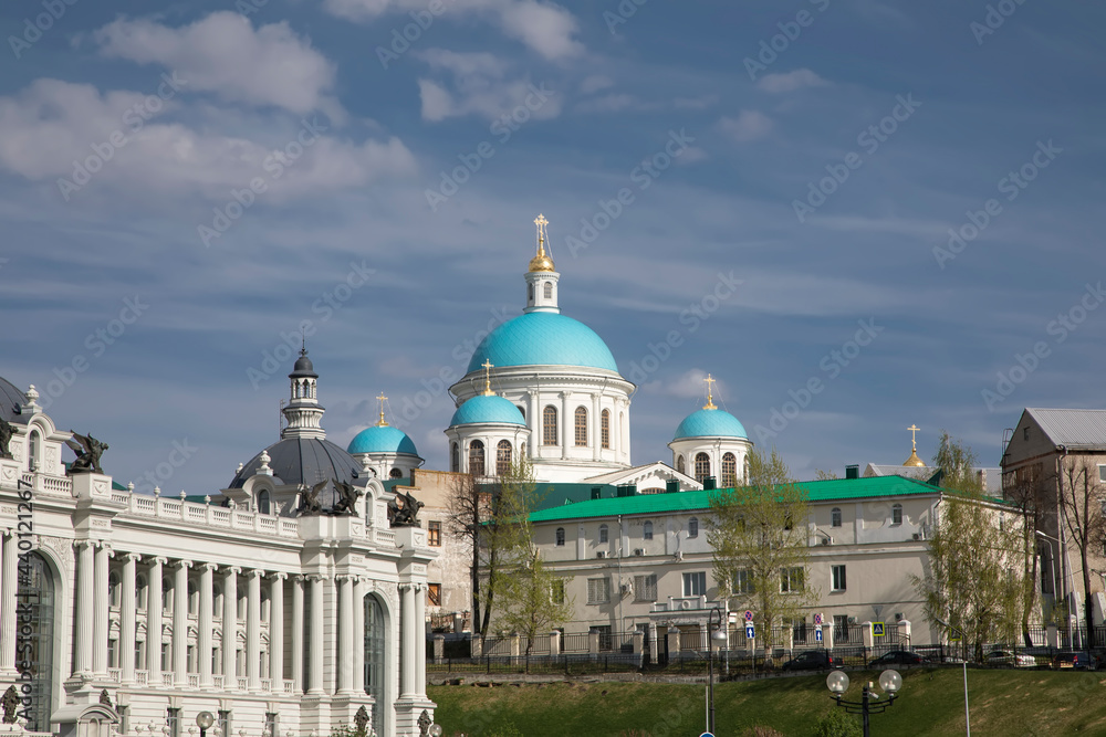 A beautiful large church with blue domes. Palace and ancient architecture. Sunny day. Blue sky.