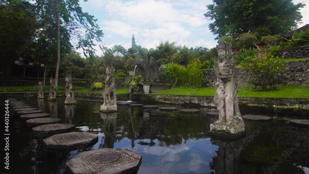 Tirta Gangga the former royal water palace is a maze of pools and fountains surrounded by a lush garden and stone carvings and statues. Tirta Gangga the former royal water palace is a maze of pools and fountains surrounded by a lush garden and stone carvings and statues.