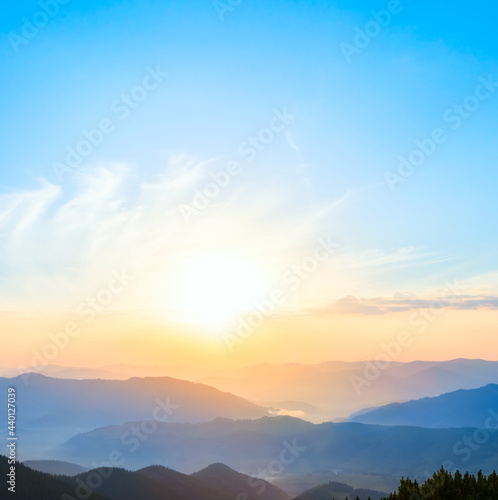 mountain valley in blue mist at the early morning, natural travel background