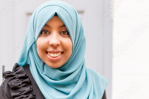 Smiling woman with brown eyes wearing hijab photo