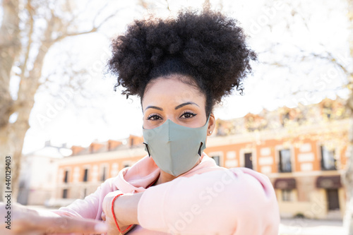 Woman wearing protective face mask during pandemic photo