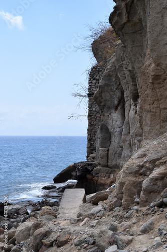 Rock Beach & Exposed Cliff with Horizon & Blue Sky 