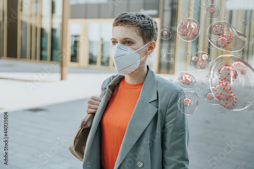 Woman wearing face mask in the city to protect herself from corona viruses photo