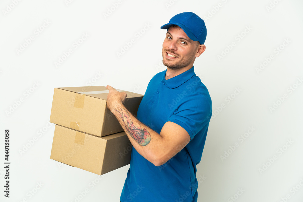 Delivery caucasian man isolated on white background pointing back Delivery caucasian man isolated on white background pointing back